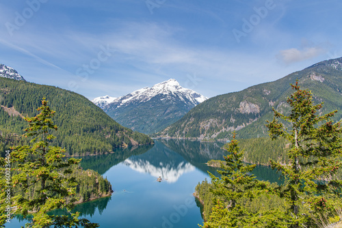 Fototapeta Naklejka Na Ścianę i Meble -  Landscape of Diablo Lake in the Snowcapped North Cascades Mountains and Forest with Davis Peak in the Background in Whatcom County, Washington, USA