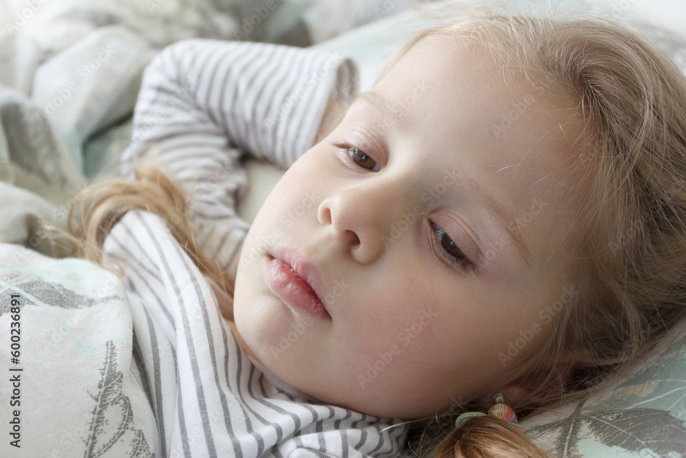 Little cute kid sleeping in the bed. Concept of rest at home Little cute kid sleeping in the bed. Concept of rest at home