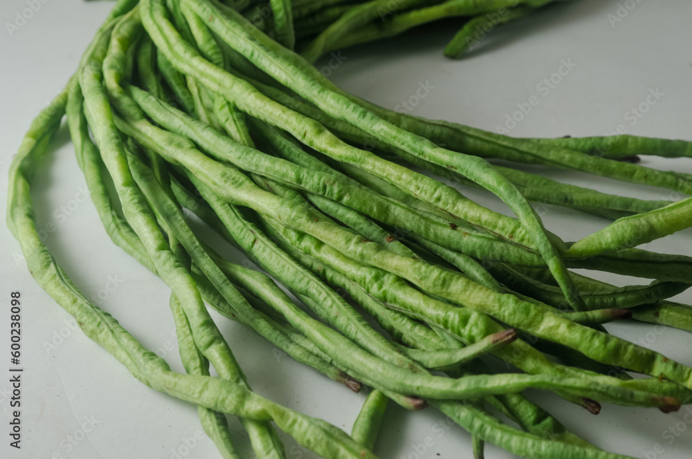 A bunch of raw long beans isolated on a white background