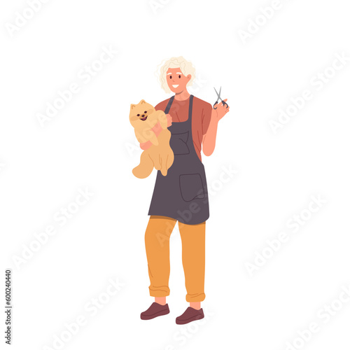 Woman pet groomer holding puppy and scissors in hands standing isolated on white background