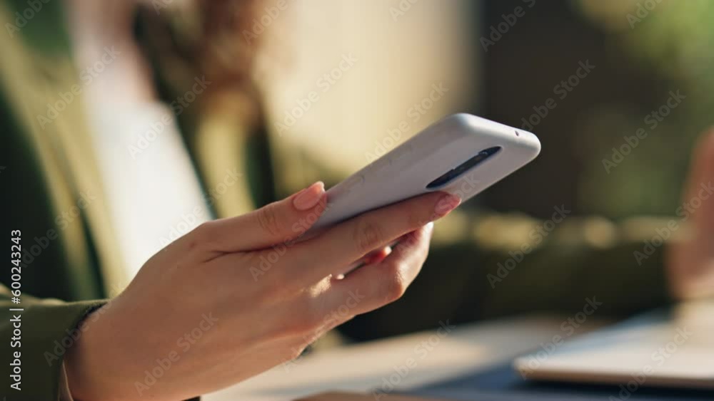 Woman hand taking telephone to answer call indoors close up. Girl speaking phone