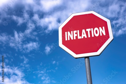 Stop traffic sign with text INFLATION to improve macroeconomic situation and lower devaluation of money