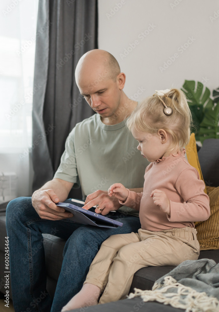 Deaf kid with hearing aid cochlear implant have fun with father - Hear aid and medicine innovating technology and diversity concept Deaf kid with hearing aid cochlear implant have fun with father - Hear aid and medicine innovating technology and diversity concept