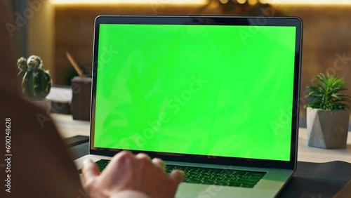Worker scrolling touchpad green screen laptop at office workplace close up. photo