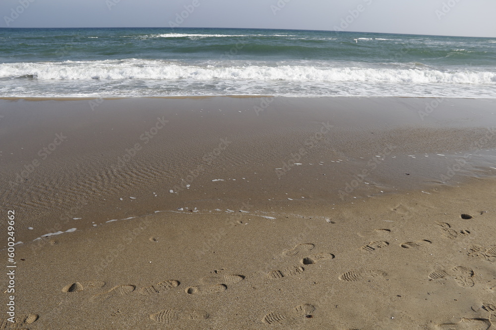 sea. beach. footprints in the sand. sea. beach. footprints in the sand.