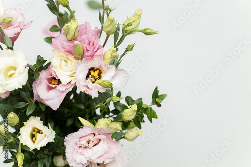 Bunch of beautiful eustoma flowers on light background © rynaonair