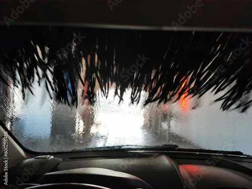 Car Care Business. Automatic Car Wash Process. Spray foam bubble shampoo on the car surface. Inside view, copy space