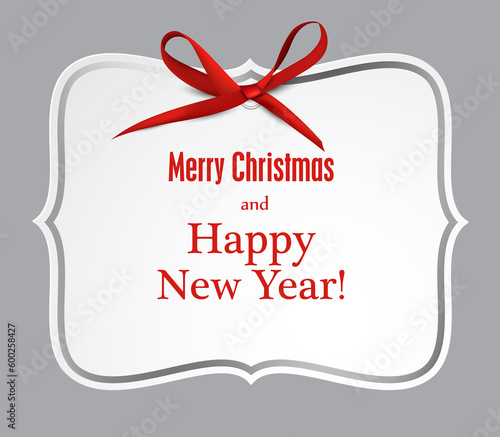 White paper gift card with red satin bow.