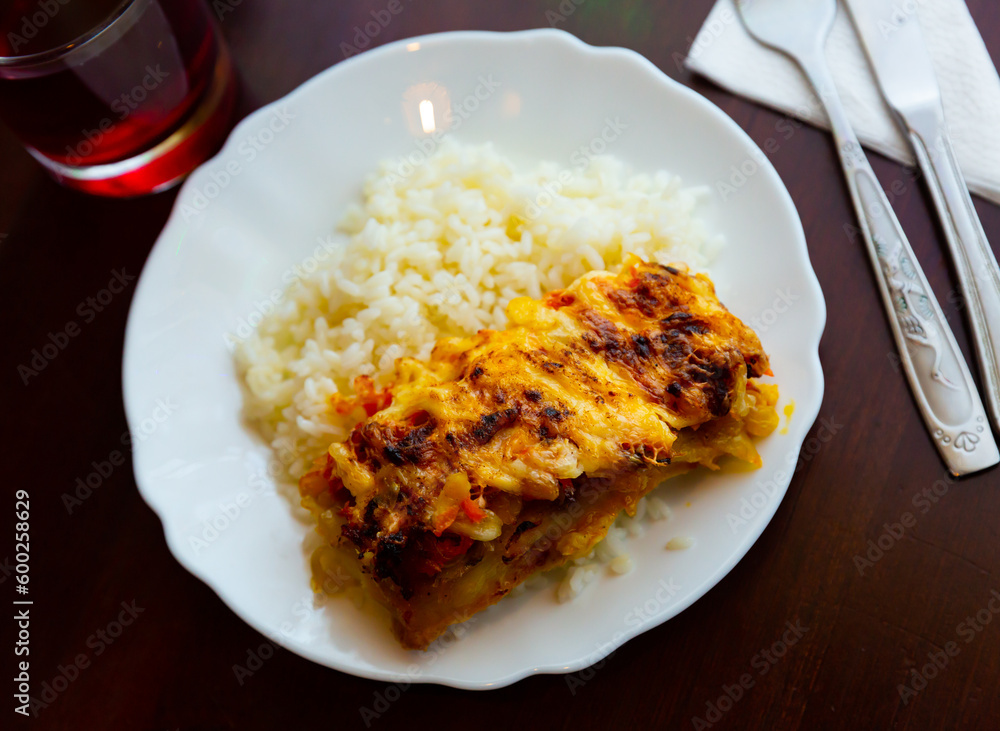 Baked chicken fillet with mushrooms and rice. Russian traditional cuisine