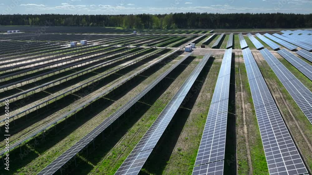 Aerial view of solar panels in the farm in Poland, Europe. Power plant with green field, renewable energy source in Poland, Europe. Eco technology for electric power in industry. Aerial view of solar panels in the farm in Poland, Europe. Power plant with green field, renewable energy source in Poland, Europe. Eco technology for electric power in industry.