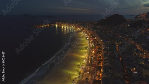Wallpaper Mural RIO DE JANEIRO, BRAZIL- CIRCA 2022: Fly above famous Copacabana beach and Atlantic ocean coast at sunset. Aerial drone video. Torontodigital.ca