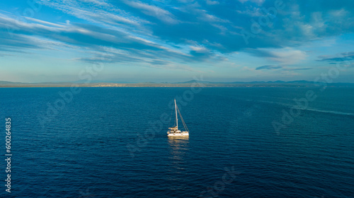 Boat moving on the sea. Sailing boat on the sea at sunset