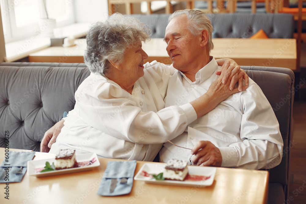 Beautiful old couple sitting in a cafe Beautiful old couple sitting in a cafe