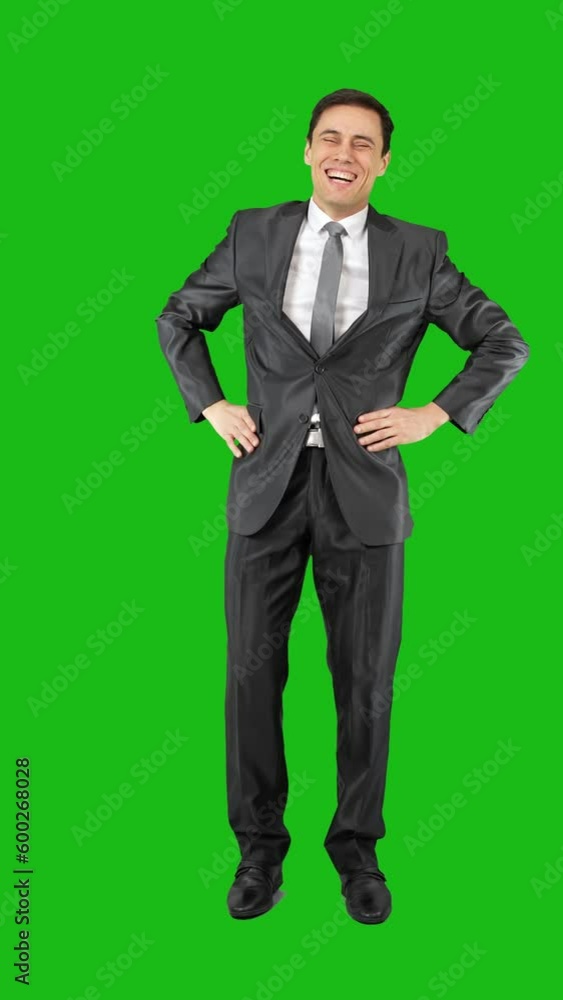 Cheerful male worker in suit smiling in chroma key Cheerful male worker in suit smiling in chroma key