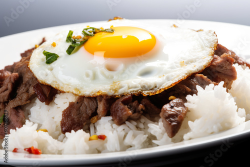 Tapsilog - a breakfast dish of beef, garlic rice, and fried egg. Asian Filipino dish, food from Philippines Generative AI