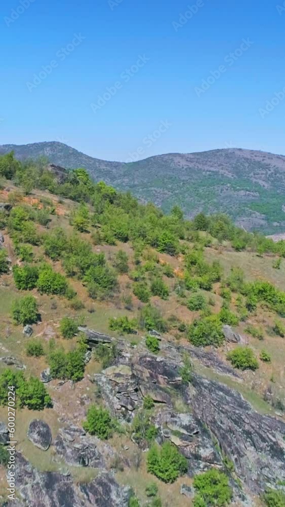 Beautiful nature, drone flight over hills, blue lake, skyline, vertical footage Beautiful nature, drone flight over hills, blue lake, skyline, vertical footage