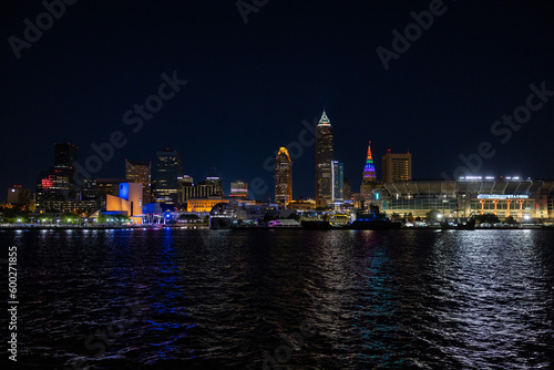 Cleveland Downtown from Lake Erie during night with illuminated skyline.