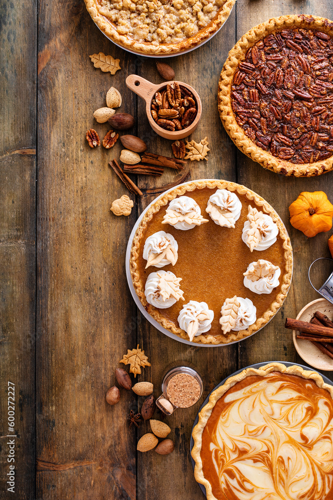 Traditional Thanksgiving pies with pumpkin pie in the middle Traditional Thanksgiving pies with pumpkin pie in the middle
