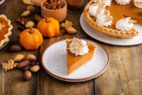 Traditional pumpkin pie for Thanksgiving with whipped cream