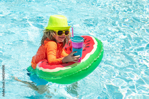 Child in swimming pool. Summer activity. Healthy kids lifestyle. Kids summer vacation  swimming and relax.