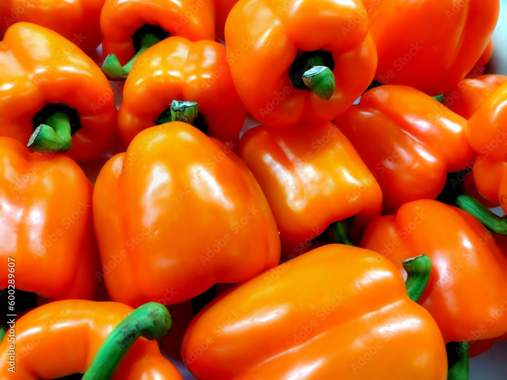 large quantity of loose red peppers with green caps large quantity of loose red peppers with green caps