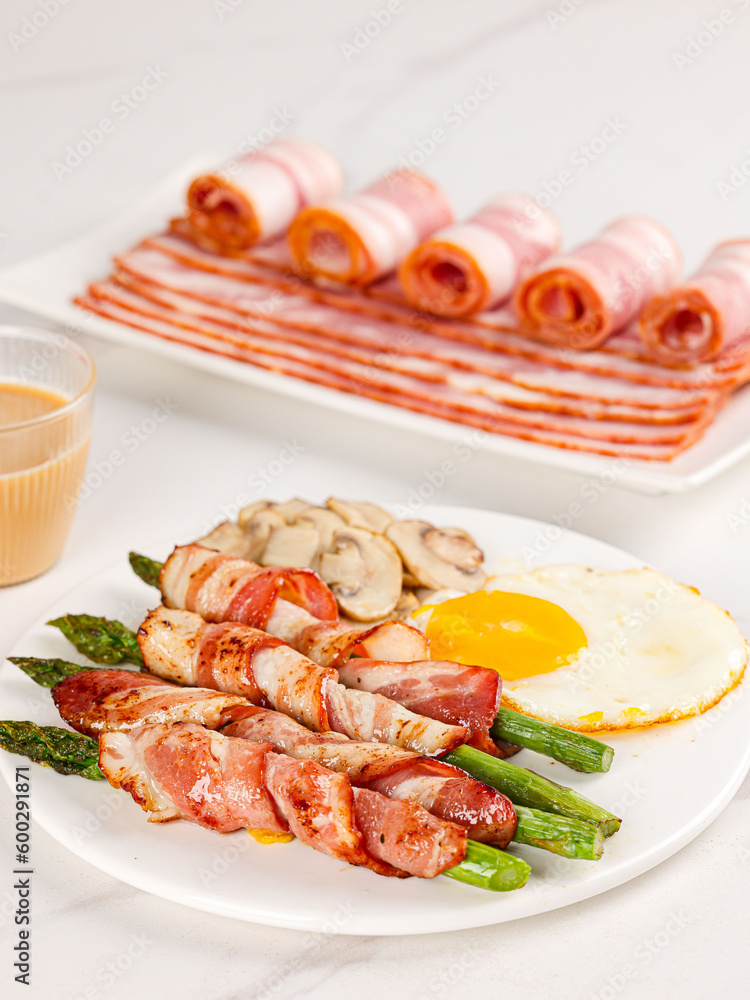 Bacon in a plate, bacon pork rolls in various recipes, on a white kitchen tabletop, indoor scene