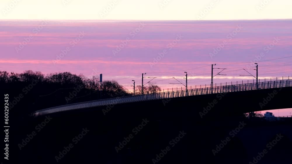 Stockholm, Sweden Sunrise over the Arstaviken freshwater lake and the Arsta train and pedestrian bridges. Stockholm, Sweden Sunrise over the Arstaviken freshwater lake and the Arsta train and pedestrian bridges.