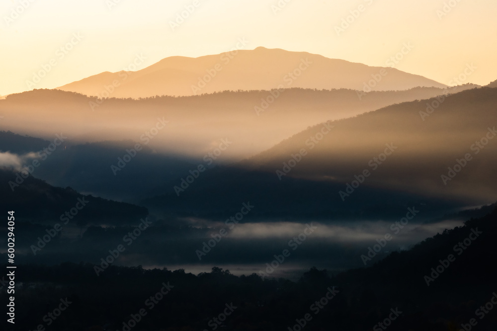 Layers of mountains on a cold foggy morning in winter Layers of mountains on a cold foggy morning in winter