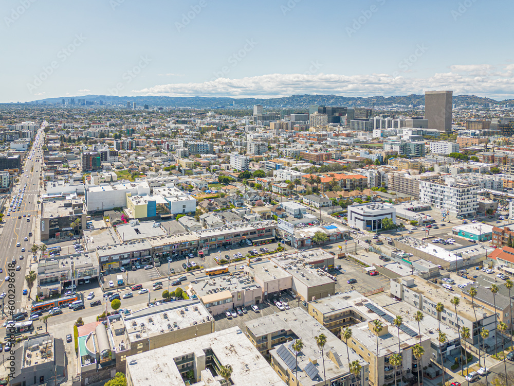 Los Angeles, California – May 3, 2023: aerial city view drone photo toward Olympic Blvd and Vermont Ave in Koreatown LA showing Korean shops, apartments, homes, streets, buildings
