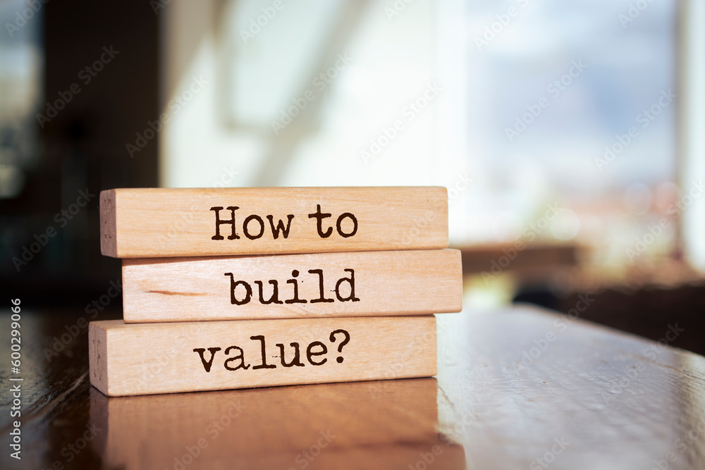 Wooden blocks with words 'How to build value?'. Wooden blocks with words 'How to build value?'.