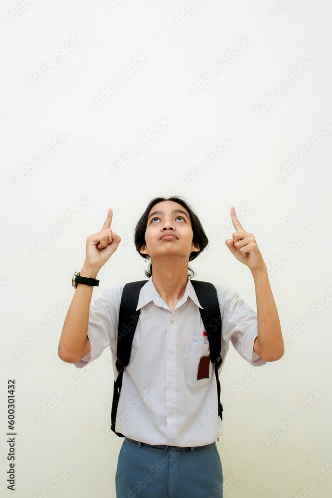 Indonesian male high school students wearing gray and white uniforms. Isolated on a White background. Indonesian male high school students wearing gray and white uniforms. Isolated on a White background.