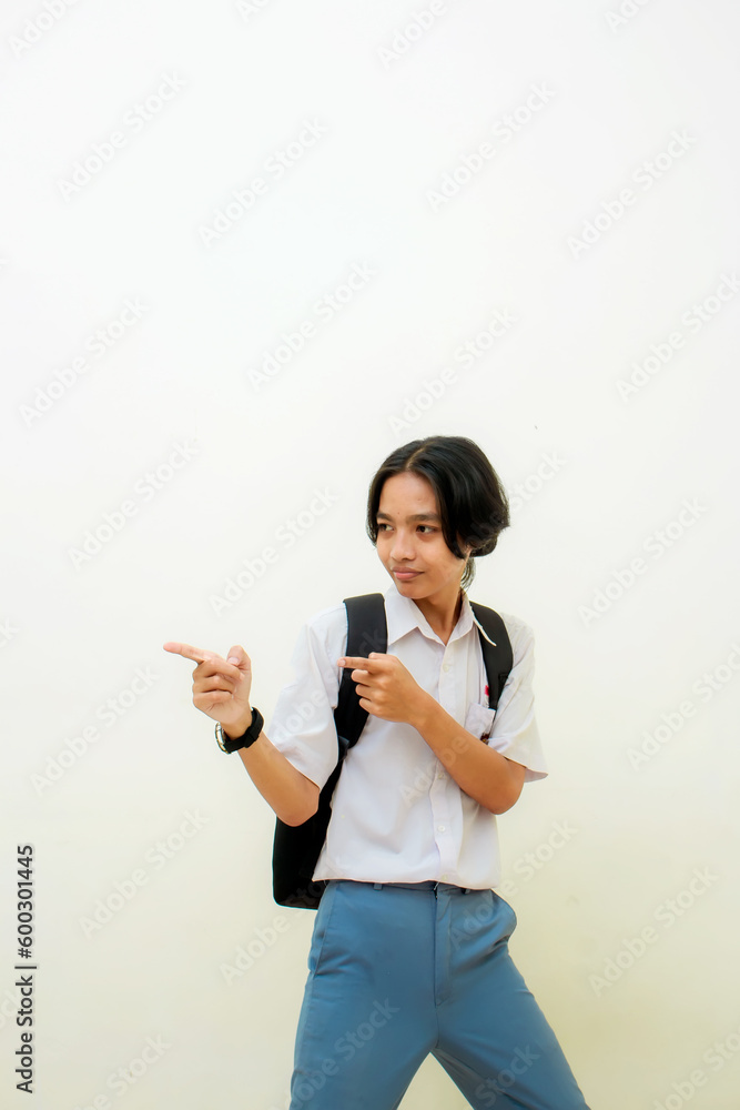 Indonesian male high school students wearing gray and white uniforms. Isolated on a White background. Indonesian male high school students wearing gray and white uniforms. Isolated on a White background.