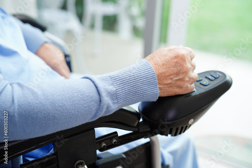 Asian elderly woman disability patient sitting on wheelchair in hospital, medical concept.