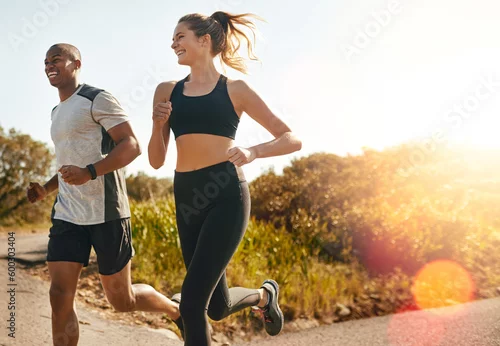 Obraz Fitness, running and health with couple in road for workout, cardio performance and summer. Marathon, exercise and teamwork with black man and woman runner in nature for sports, training and race