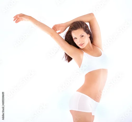 Obraz Woman, healthy body and portrait with underwear in studio for wellness, youth or white background. Isolated girl, model and lingerie with stretching arms, health or fitness with beauty, sexy or pride
