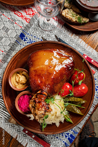 Canvas Print Tasty grilled ham hock on a plate with  cabbage salad
