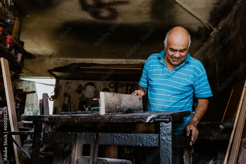 portrait of latin senior man carpenter working with wood at the furniture carpentry workshop in Mexico Latin America, hispanic worker portrait of latin senior man carpenter working with wood at the furniture carpentry workshop in Mexico Latin America, hispanic worker