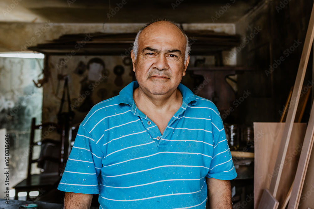 portrait of latin senior man carpenter working with wood at the furniture carpentry workshop in Mexico Latin America, hispanic worker portrait of latin senior man carpenter working with wood at the furniture carpentry workshop in Mexico Latin America, hispanic worker