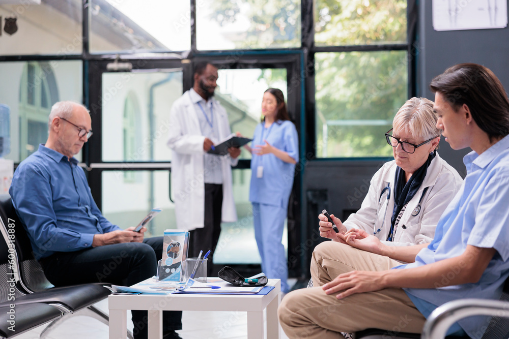 Elderly medic doing insulin level measurement with instrument to help