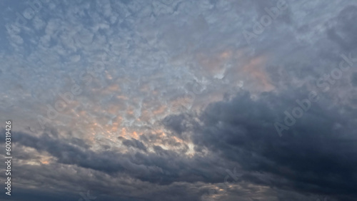 Fototapeta Naklejka Na Ścianę i Meble -  beautiful yellow, blue and orange light sunrise clouds cloudscape - photo of nature