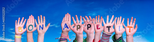 Children Hands Building Word Bon Appetit, Blue Sky