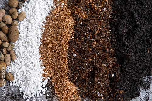 Ingredients for the soil of home potted plants, peat, earth, sand, perlite, vermiculite, coconut. A mixture for planting plants in a pot. Layout photo