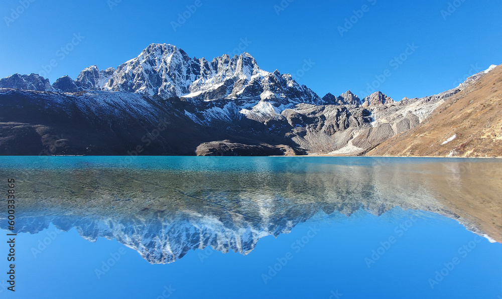reflation of mountains on the world's highest Gokyo lake .