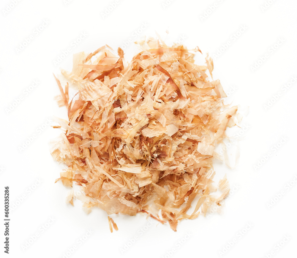 a pile of dry bonito fish flake katsuobushi isolated on white