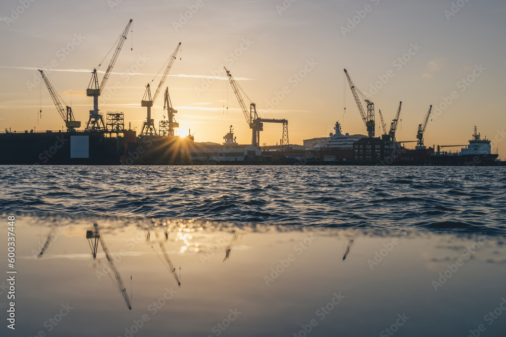 Germany, Hamburg, Cranes of Port of Hamburg at sunrise Germany, Hamburg, Cranes of Port of Hamburg at sunrise