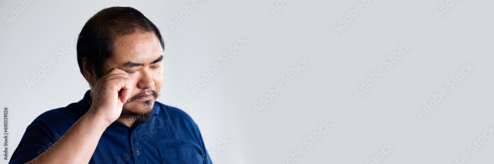 Portrait of visual-impaired asian man with eye irritation or eye inflammation Portrait of visual-impaired asian man with eye irritation or eye inflammation