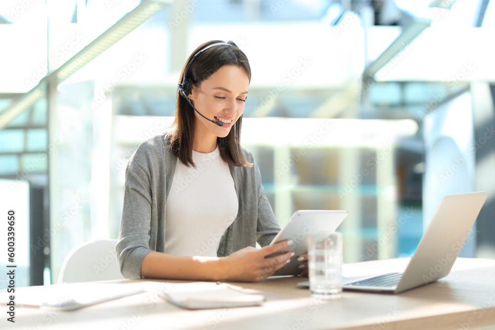 Woman customer support operator with headset and smiling Woman customer support operator with headset and smiling