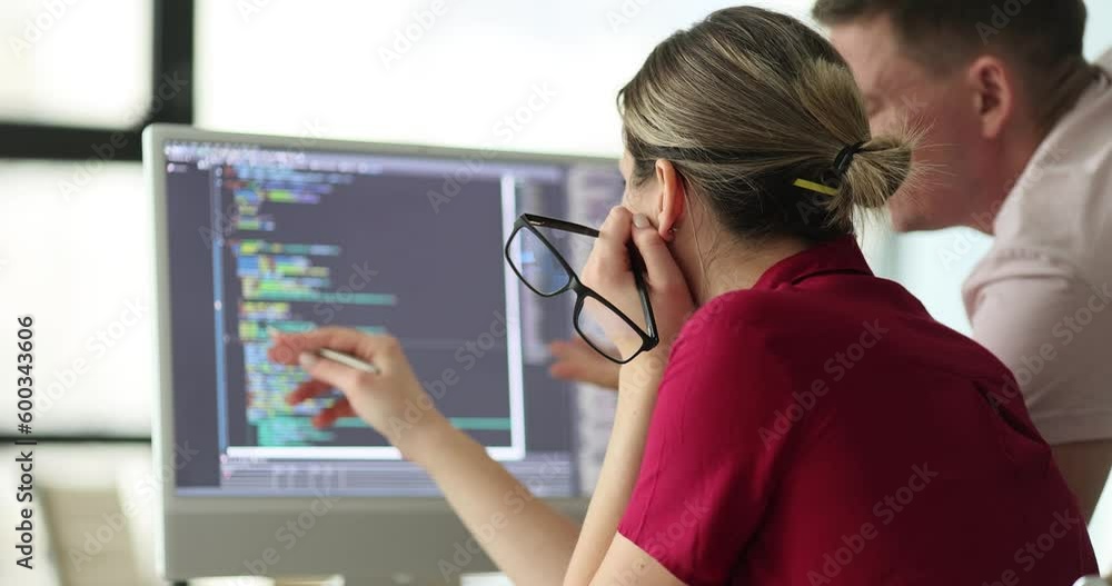 AI programmers and IT software developers are brainstorming. Team is programming on computer in startup company