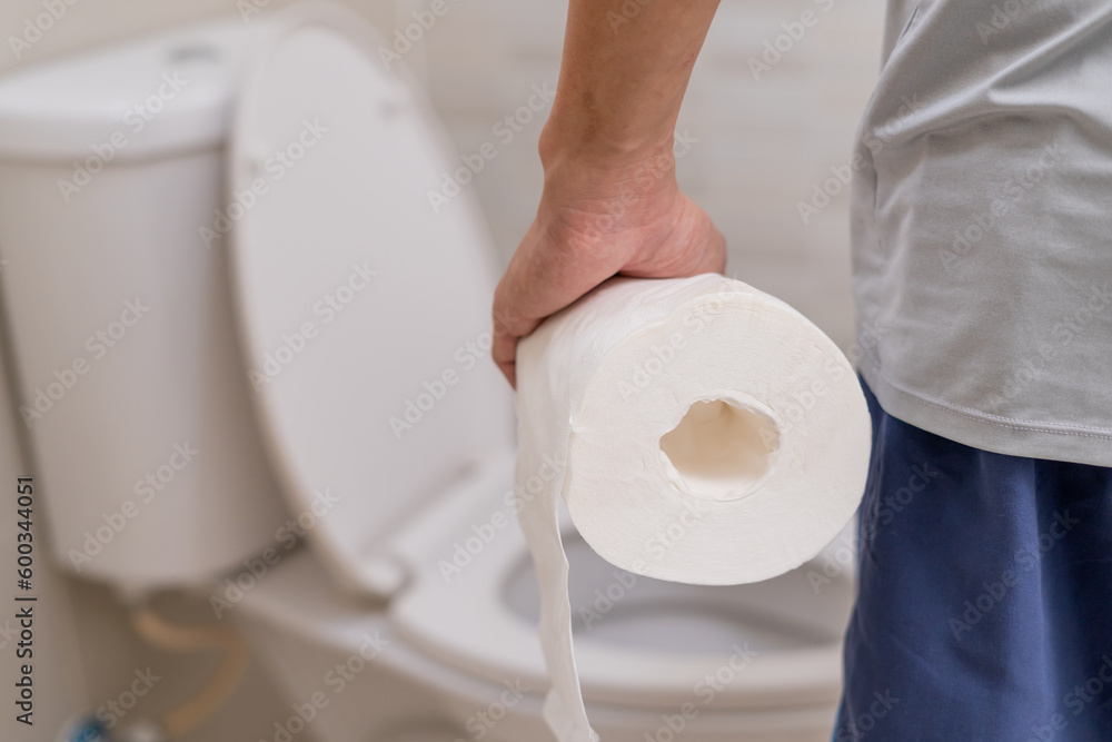 Constipation and diarrhea in bathroom. Hurt man touch belly stomach