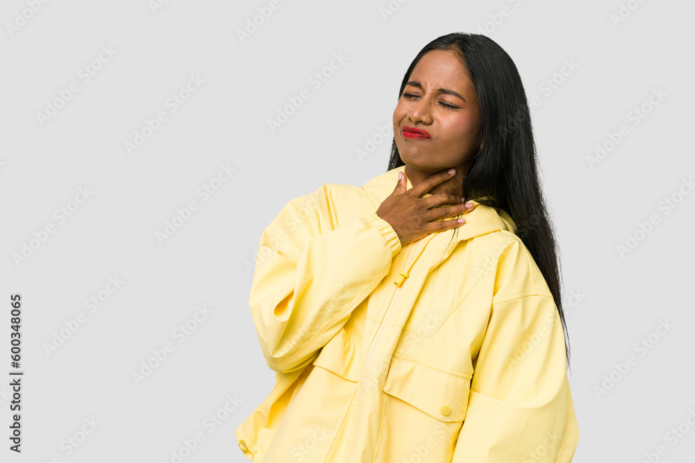 Young Indian woman cut out isolated on white background touching back of head, thinking and making a choice. Young Indian woman cut out isolated on white background touching back of head, thinking and making a choice.